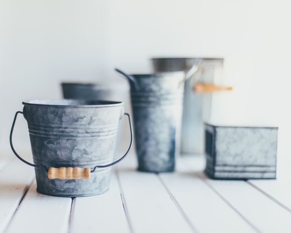 Several metal buckets in different sizes.