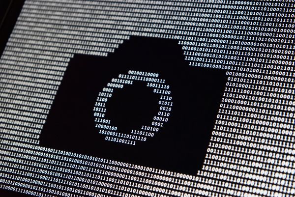 Ocean of 0s and 1s with missing digits in the shape of a camera icon.