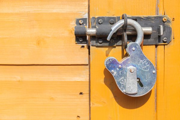 Yellow door with an old lock.